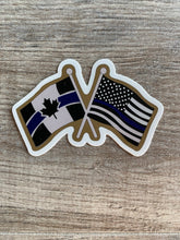 Load image into Gallery viewer, Canada-USA Crossed Thin Blue Line Flags  Sticker / Decal
